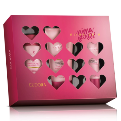 Caixa rosa com produtos de beleza EUDORA visíveis através de recortes em forma de coração