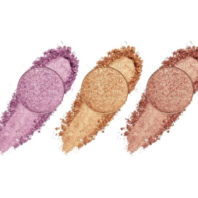 Três pós compactos de sombras de olhos brilhantes em lilás, dourado e cobre