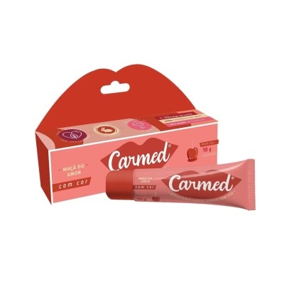 Bálsamo labial Carmed em embalagem rosa e vermelha com texto branco