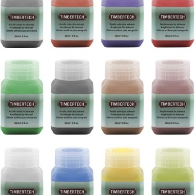 Doze frascos coloridos de tinta acrílica TIMBERTECH para aerografia dispostos em três filas