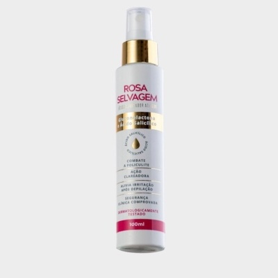 Frasco branco de spray com rótulo rosa e dourado