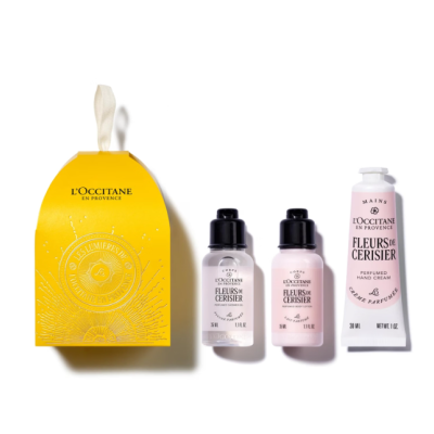 Conjunto LOccitane en Provence Fleurs de Cerisier com embalagem amarela e produtos em frascos pequenos.