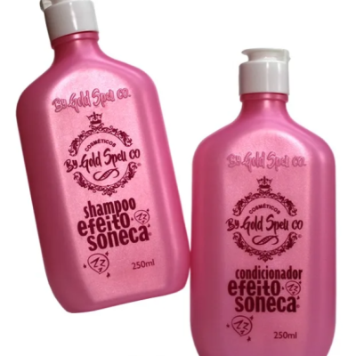 Duas embalagens rosas de shampoo e condicionador com texto em castanho