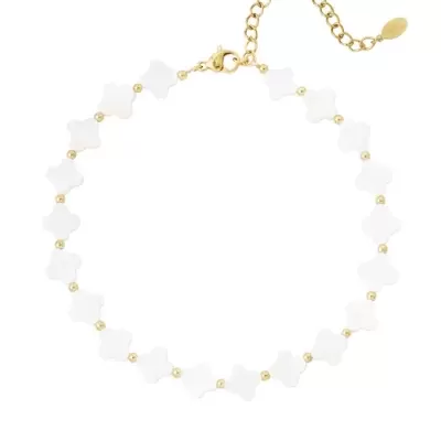 Pulseira delicada com elementos brancos em forma de cruz e detalhes dourados