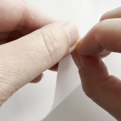 Entretela TNT autocolante