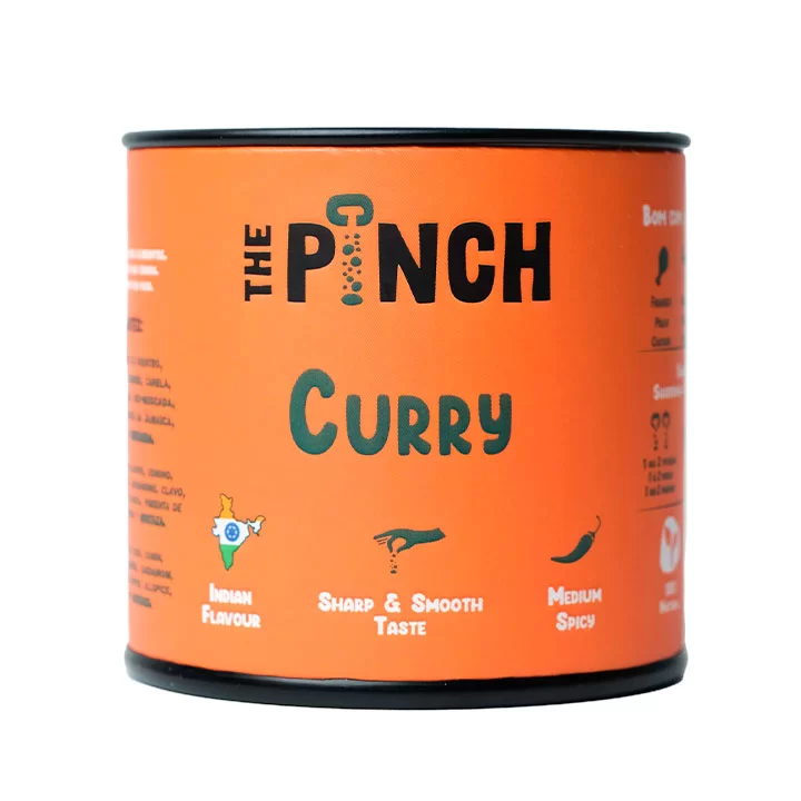 The Pinch Curry Condimento Lata laranja do produto The Pinch Curry com texto em preto e verde