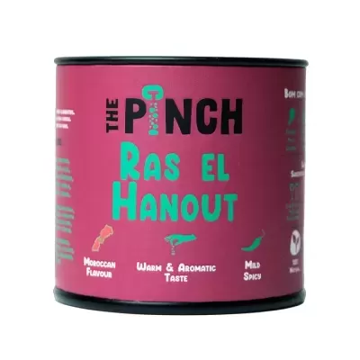 Lata de especiaria Ras El Hanout com etiqueta rosa e texto verde e preto