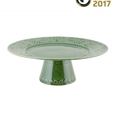 Prato de cerâmica verde decorativo sobre base, com texto 'GERMAN DESIGN AWARD NOMINEE 2017'