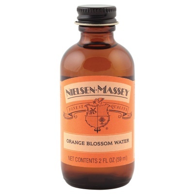 Frasco de vidro âmbar com rótulo laranja de Orange Blossom Water