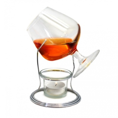 Conjunto de vidro e metal para aquecimento de bebida com copo e vela