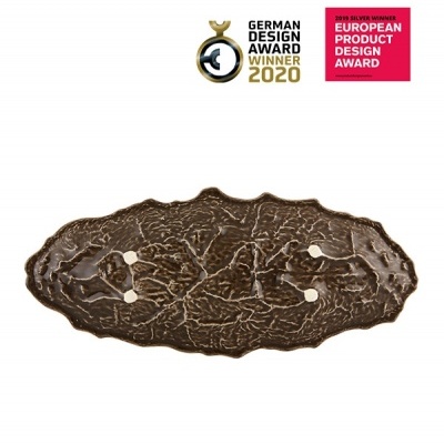 Prato decorativo bronze com textura orgânica e prémios de design