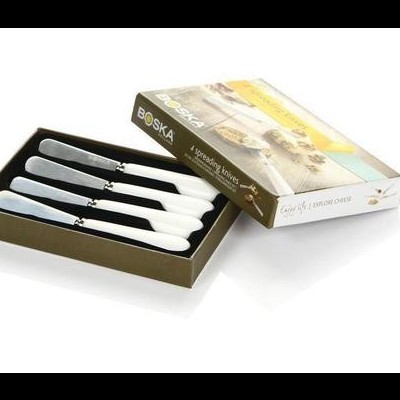 Conjunto de facas de queijo com cabos brancos na caixa