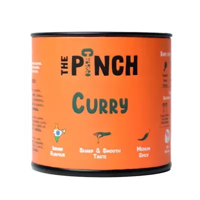 Lata laranja do produto The Pinch Curry com texto em preto e verde