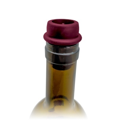 Garrafa de vidro castanho com tampa vermelha de cortiça ou silicone