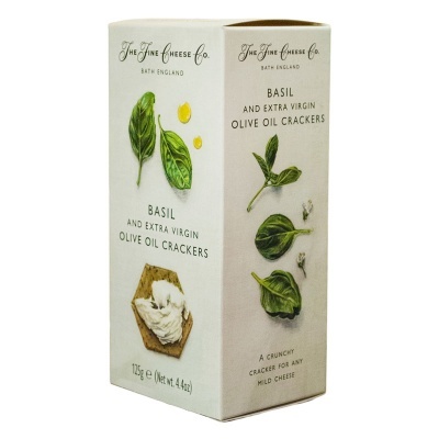 Caixa branca de crackers com ilustrações de folhas de manjericão e queijo cremoso