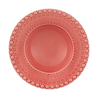 Prato vermelho cerâmico com padrão branco na borda