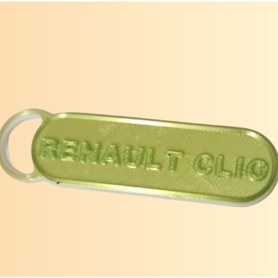 Chaveiro verde metálico com texto RENAULT CLIO