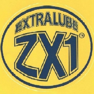 Etiqueta redonda amarela com texto EXTRALUBE ZX1 em azul