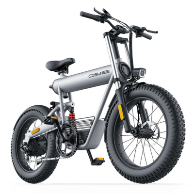 Bicicleta elétrica cinza prateado com pneus grossos e farol dianteiro