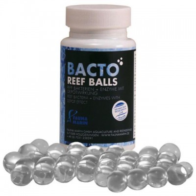 Frasco branco com etiquetas preta e azul com várias esferas transparentes à frente