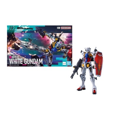 Modelo articulado de robô Gundam com escudo vermelho e arma preta ao lado da caixa.