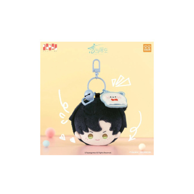 Chaveiro de peluche personagem de cabelo preto com anel e sino azuis
