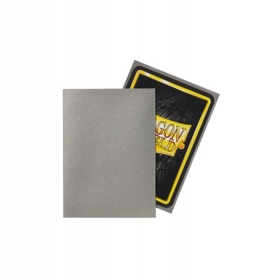 duas capas de baralhos, cinza e preta com texto DRAGON SHIELD