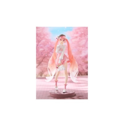 Figura anime com cabelo e roupas rosas em base circular rosa frente a flores cor-de-rosa