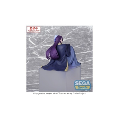 Figura colecionável feminina com cabelo roxo, casaco azul escuro e detalhes amarelos sentada sobre bloco translúcido.