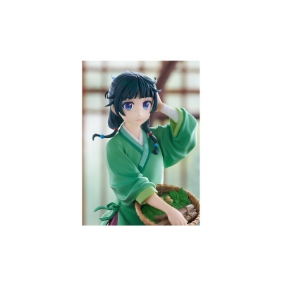 Figura anime com roupa verde e cesta de folhas verdes.