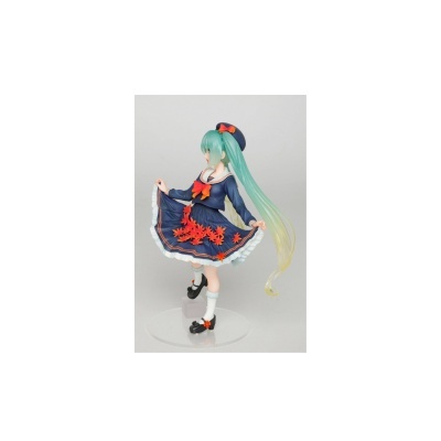 Figura decorativa de personagem feminina com vestido azul e cabelo verde