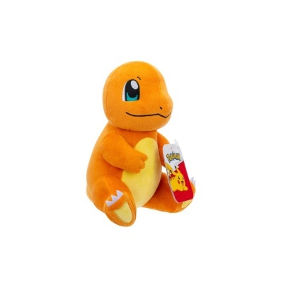 Peluche laranja de Charmander com barriga amarela e etiqueta do Pokémon