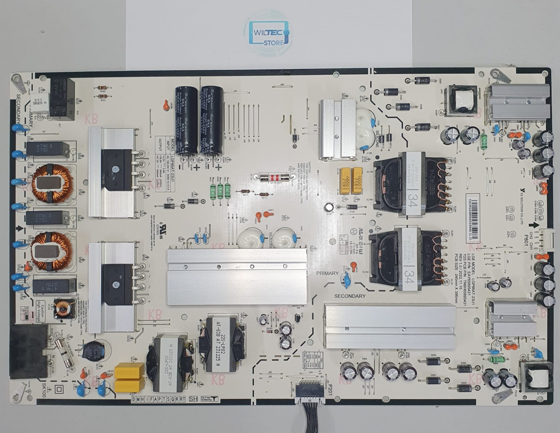 Power Supply TV LG 86UR78006LB / LGP86A-23U1 Placa eletrónica branca com componentes e dissipadores de calor sobre mesa branca e etiqueta Wiltec Store