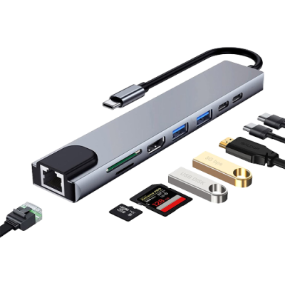 Hub USB-C cinza metálico com várias portas e acessórios como cartões de memória e pen drives