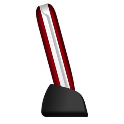 Telemóvel vermelho e branco numa base de carregamento preta