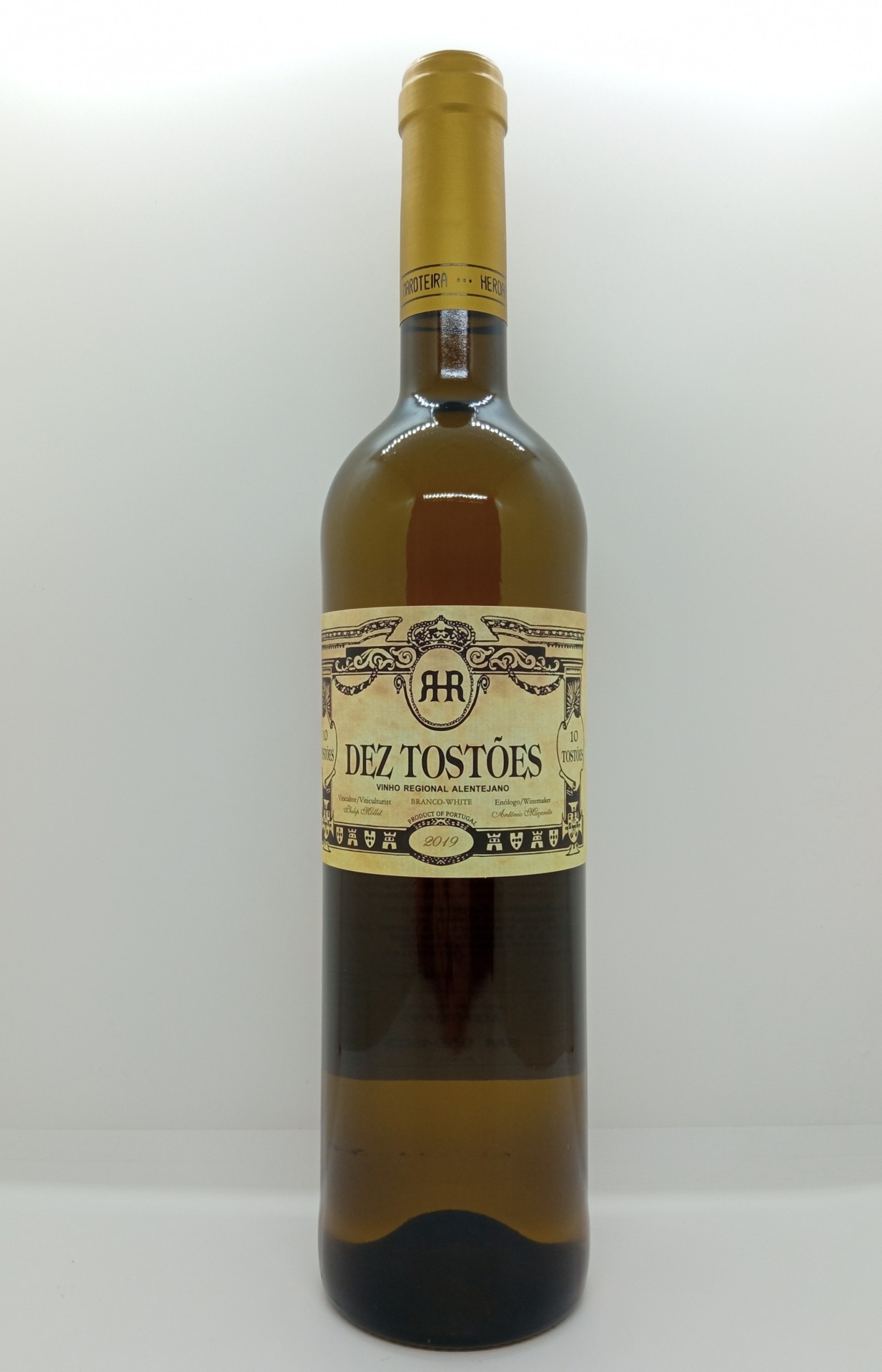 Garrafa de vinho branco Dez Tostões com rótulo creme e tampa dourada