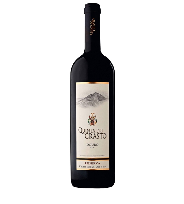 Garrafa de vinho Quinta do Crasto com rótulo branco e desenho de montanha