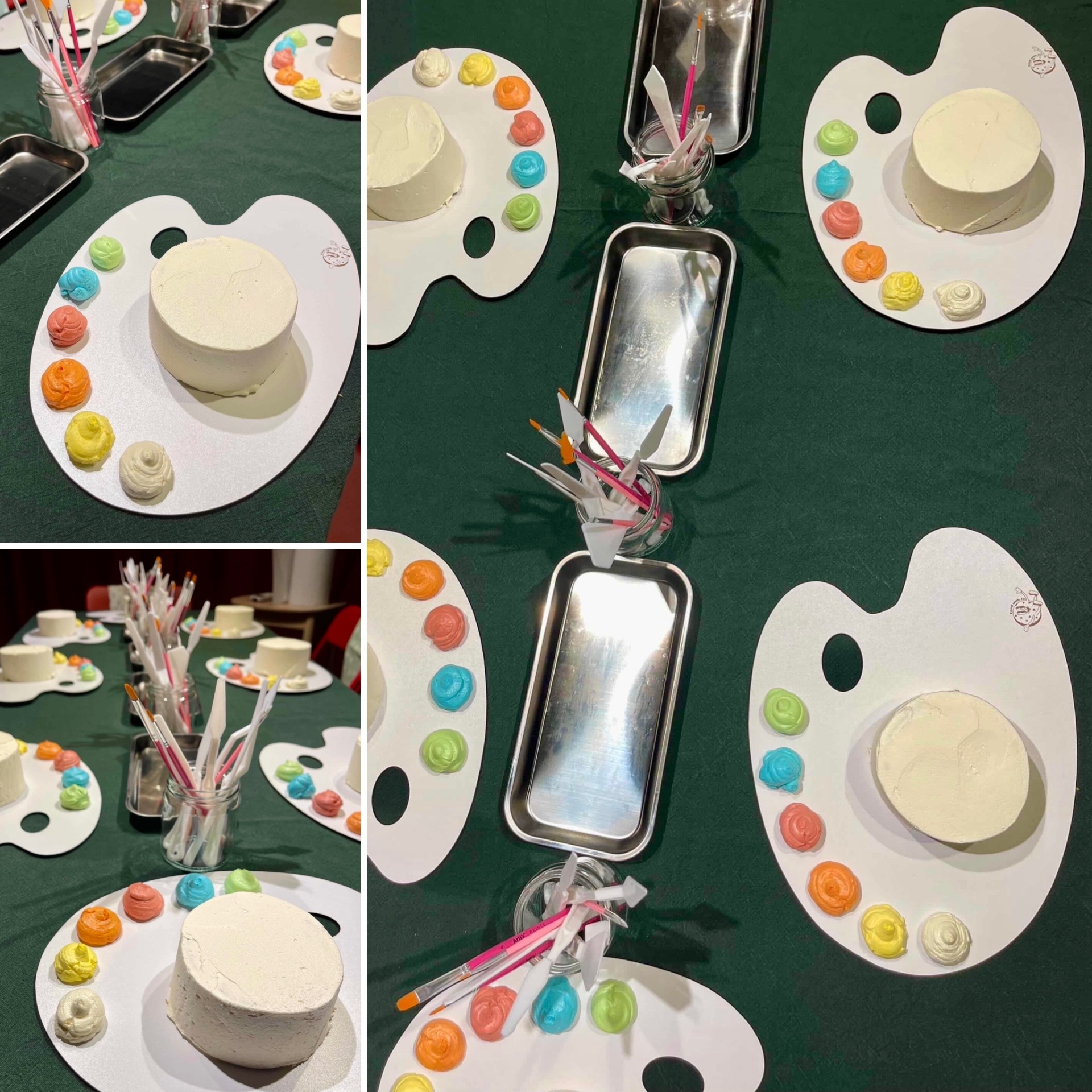 Mesa com bolos brancos em bases de paleta com decorações coloridas e pincéis em frascos.