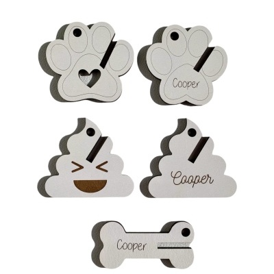 Peças de EVA em formas de pata, monte e osso com o nome Cooper