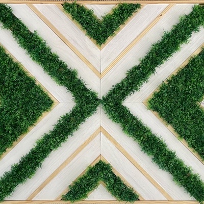 Quadro decorativo com padrão geométrico verde e madeira clara