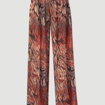 Calças compridas com padrão abstrato em tons vermelho e castanho