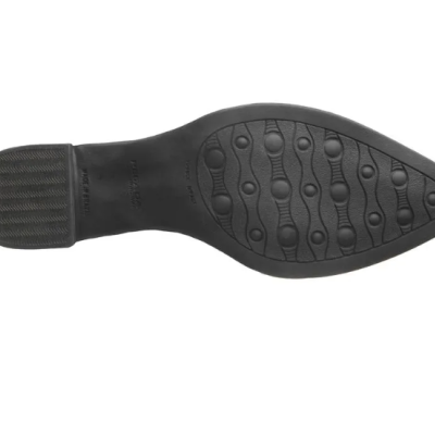 Sola preta de sapato com padrão circular e ondulado