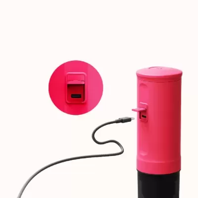 Dispositivo cilíndrico cor-de-rosa com cabo USB preto