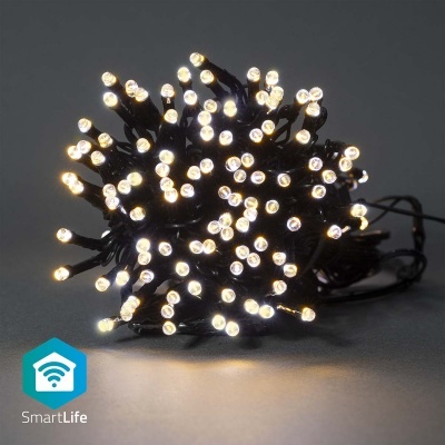 Luzes de Natal LED branco quente com fios pretos enroladas sobre superfície cinzenta.