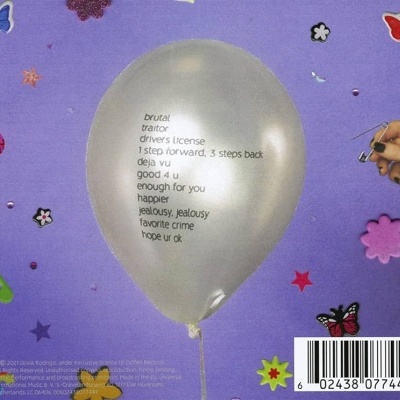 Balão cinzento com texto em fundo lilás decorado com adesivos coloridos