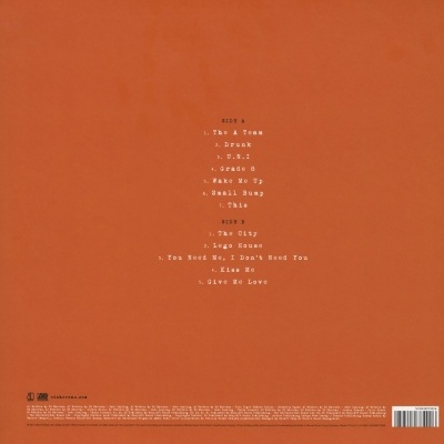 Capa traseira de disco em vinil laranja com lista de faixas em branco