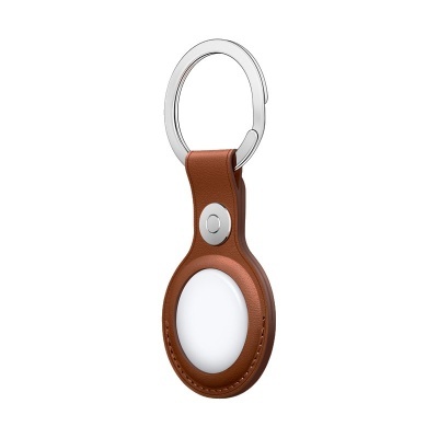 Porta-chaves de pele castanha com suporte branco oval e argola metálica prateada
