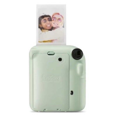 Câmara instantânea instax verde pastel a imprimir foto