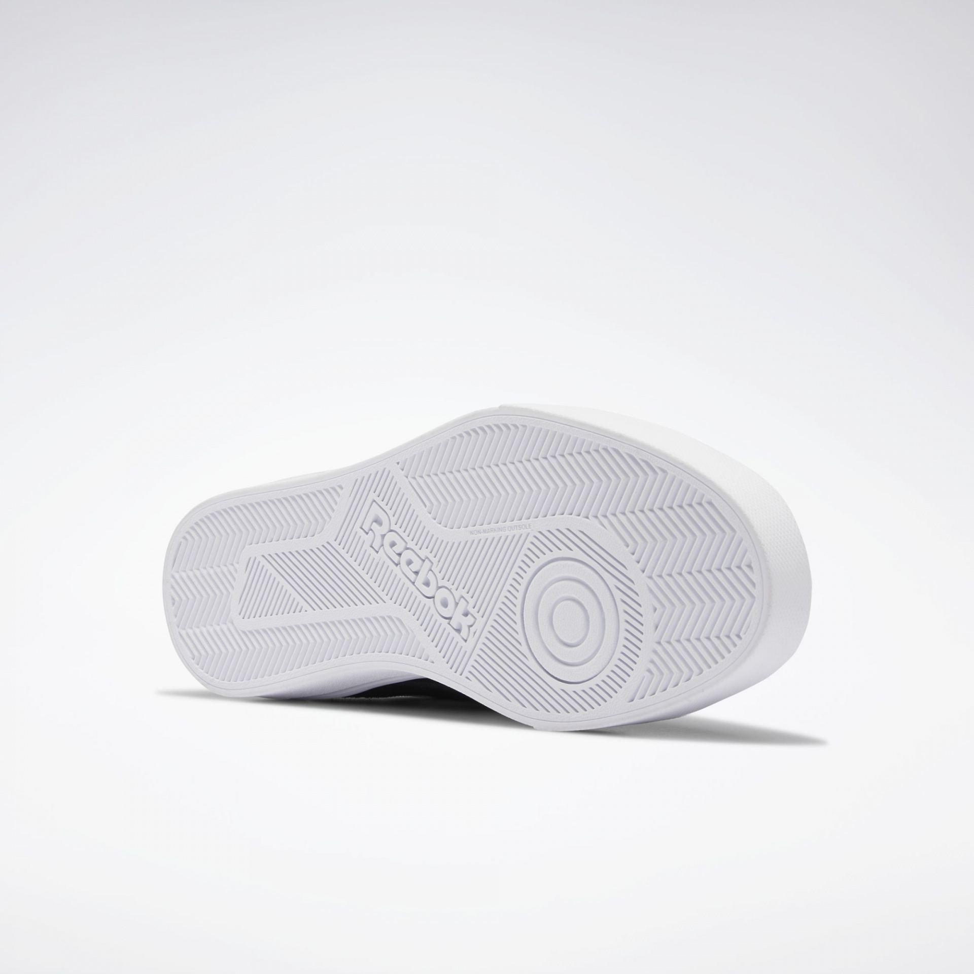 Sola branca antiderrapante de sapatilha Reebok com logótipo em relevo