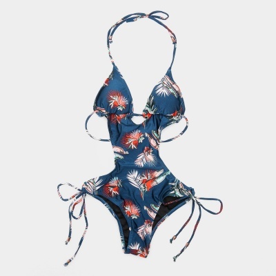 Fato de banho azul escuro com padrão de folhas e flores e tiras para amarrar